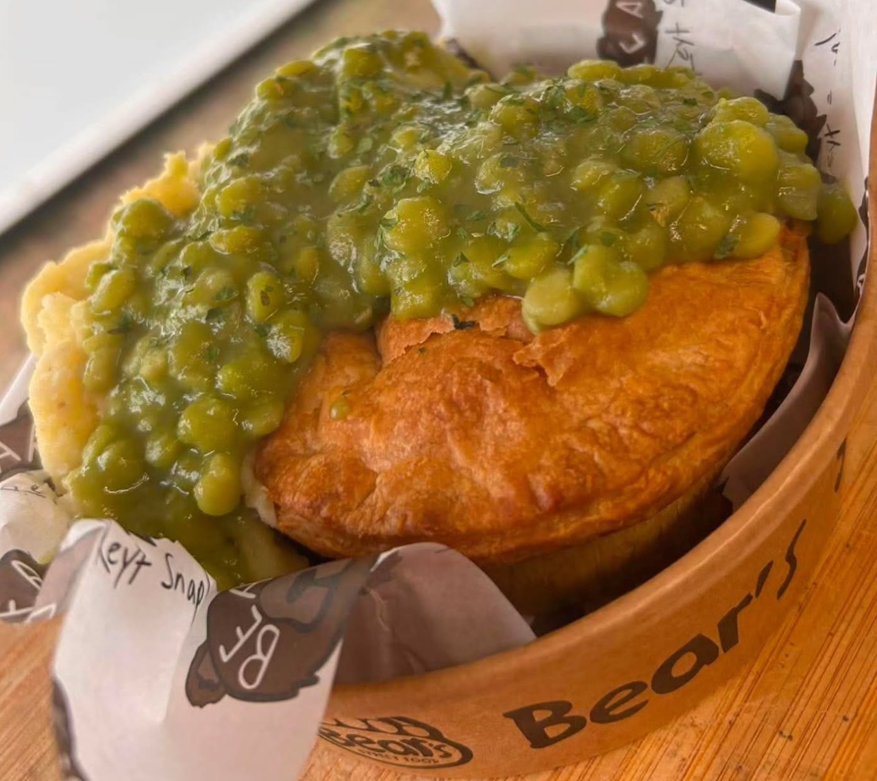 A golden shortcrust artisan steak pie served alongside smooth mash and rich gravy for TV & film catering on location.